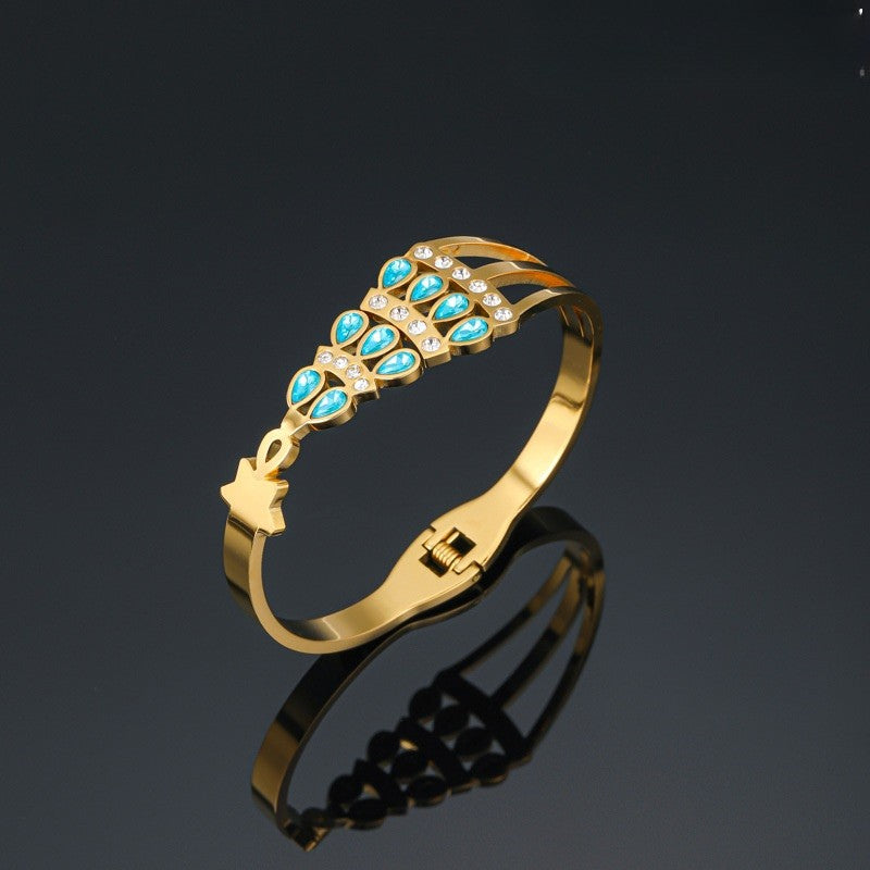 Gold Tone Stainless Steel Blue Crystal Bangle