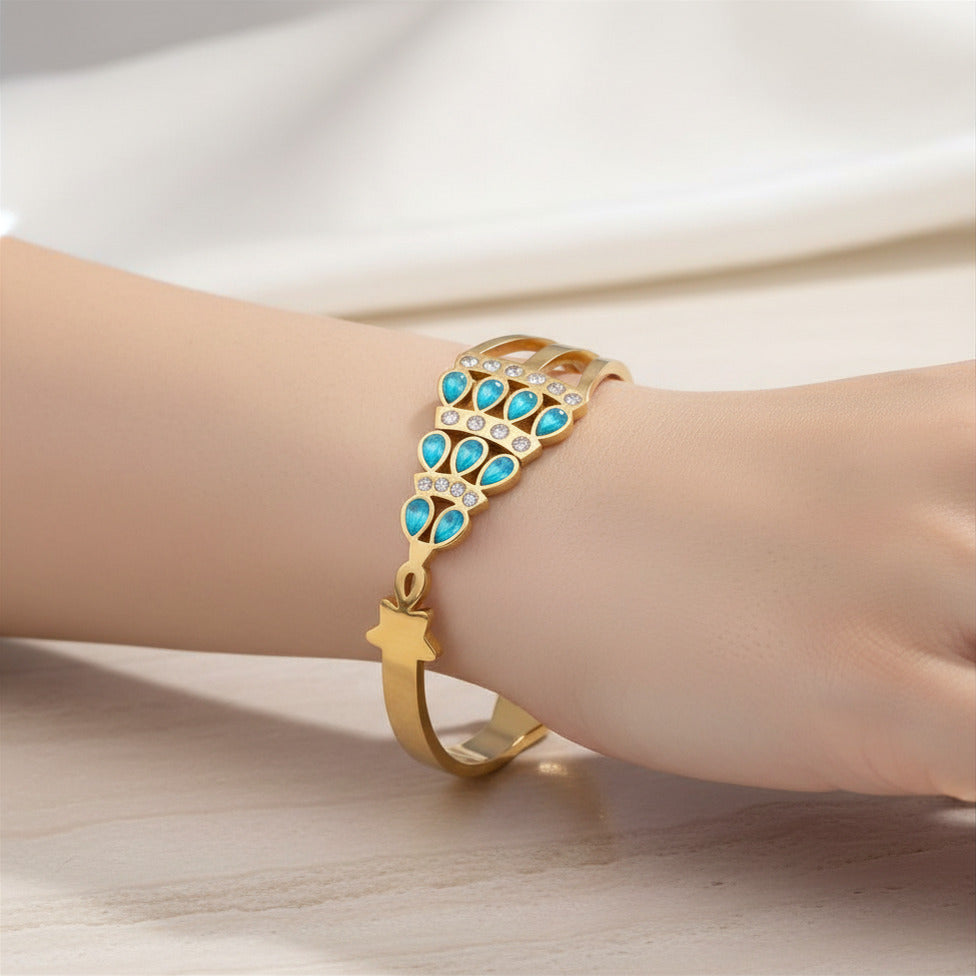 Gold Tone Stainless Steel Blue Crystal Bangle